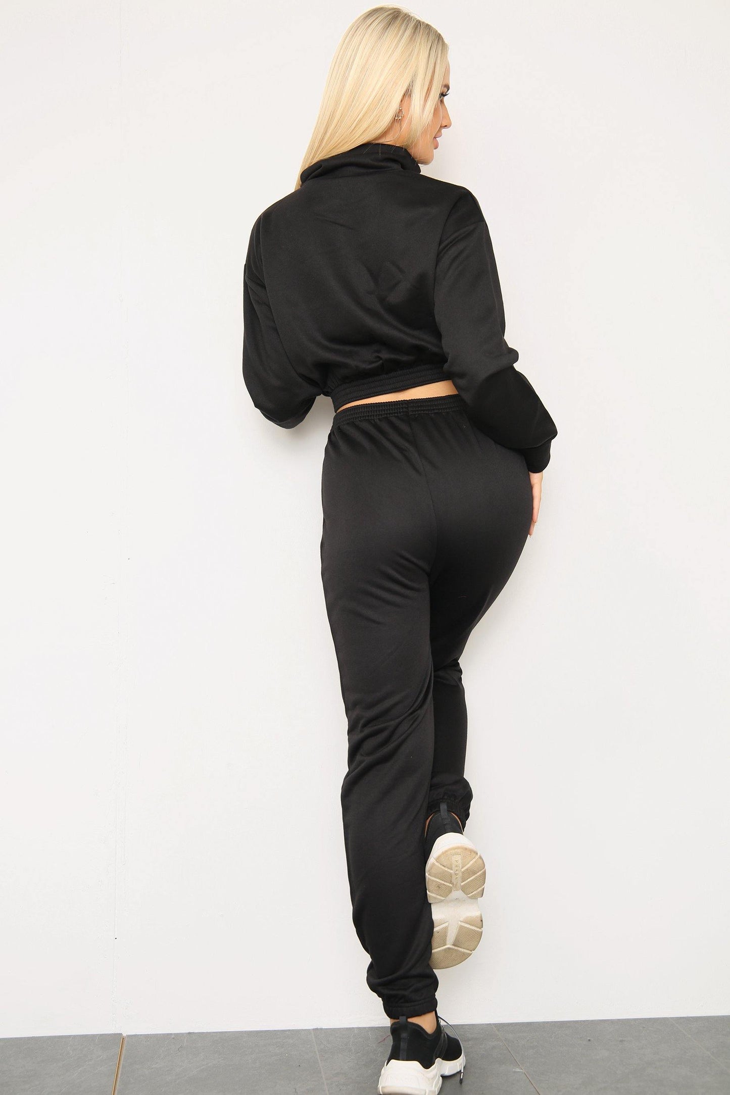 Back view of long sleeve zipper crop top with oversized matching joggers