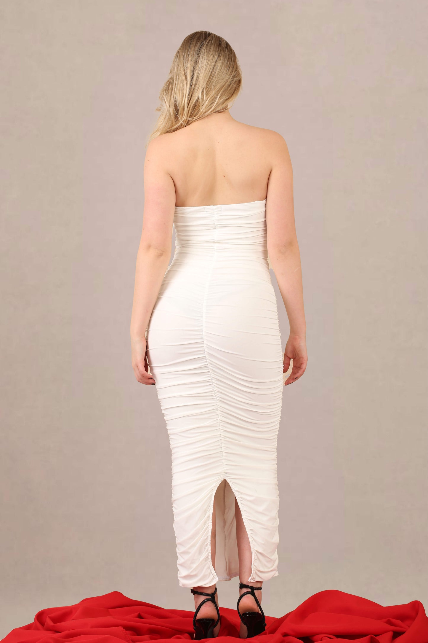 Ruched bodycon fit slinky bandeau midi dress back view
