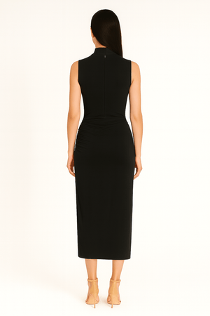 Back view of ruched slim fit jersey sleeveless midi dress in black color highlighting the fit