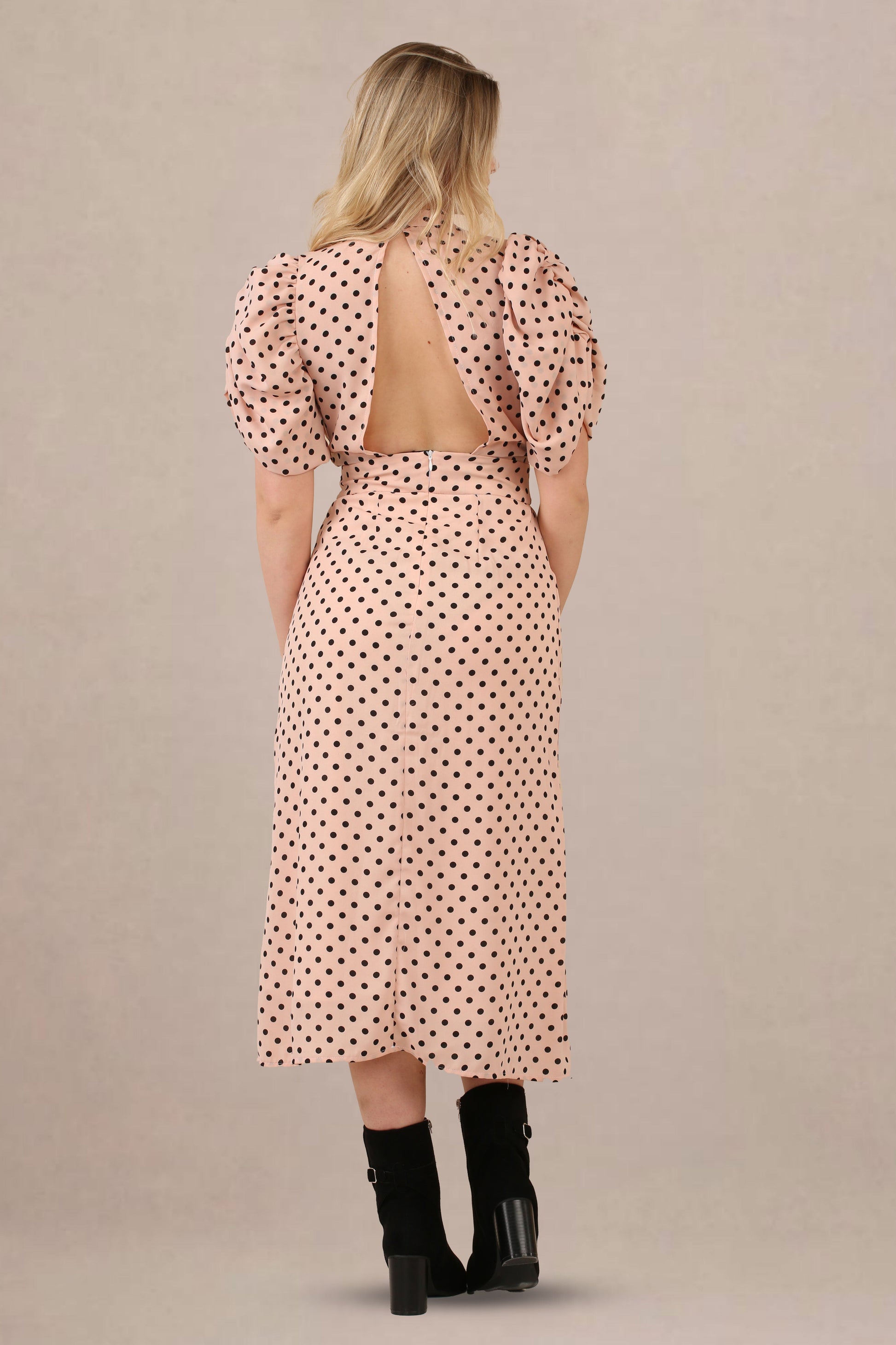 Back view of vintage-inspired puff sleeves polka dot midi dress