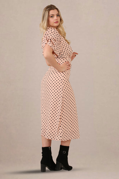 Side look of vintage-inspired puff sleeves polka dot midi dress