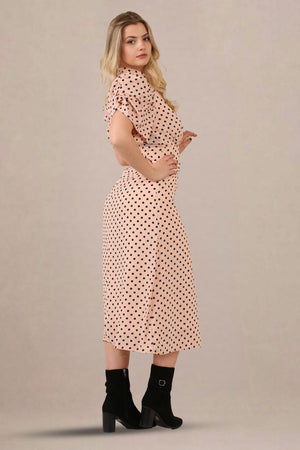 Side look of vintage-inspired puff sleeves polka dot midi dress
